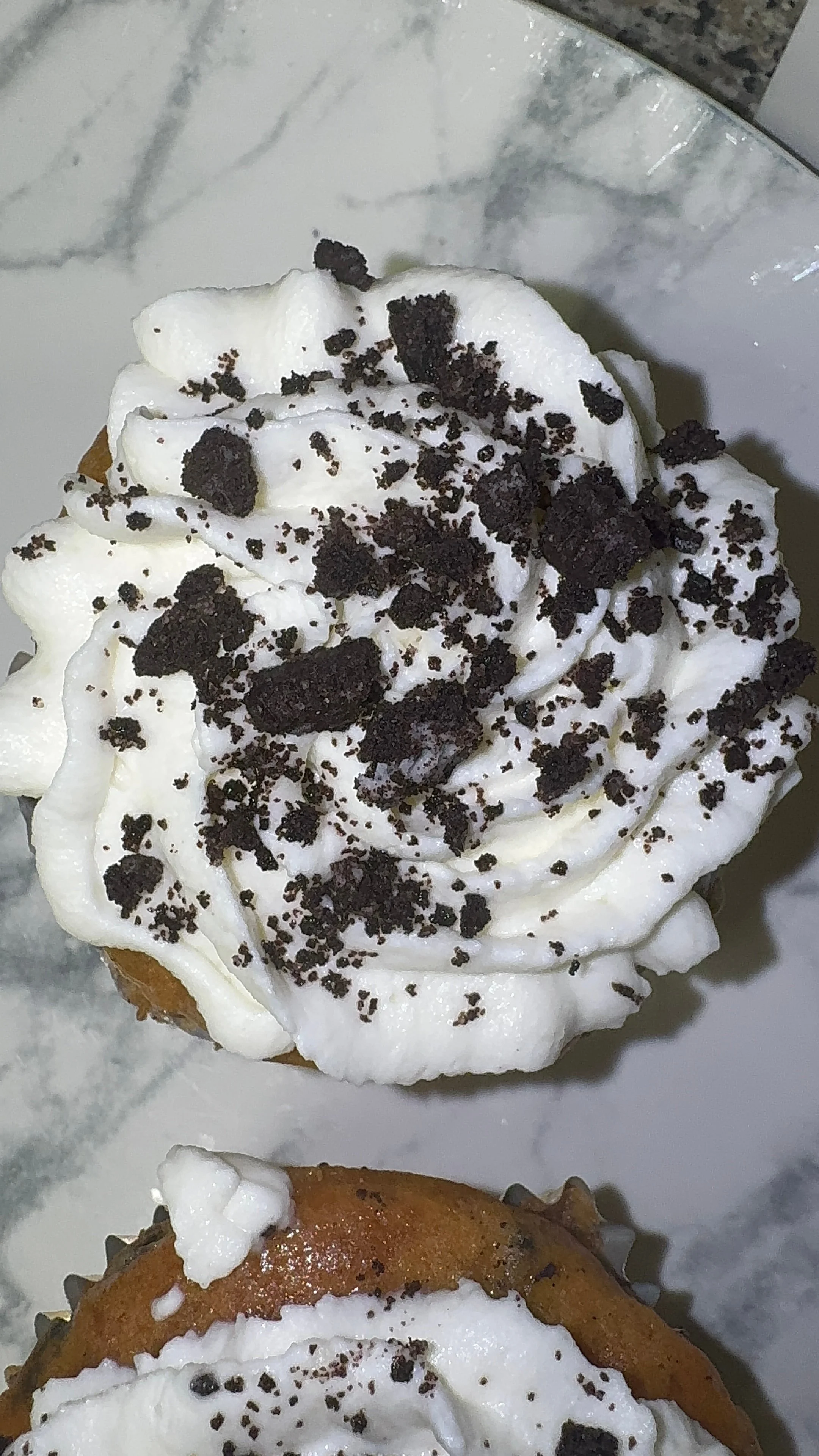 Cookies and cream cupcake topped with cookie crumbs